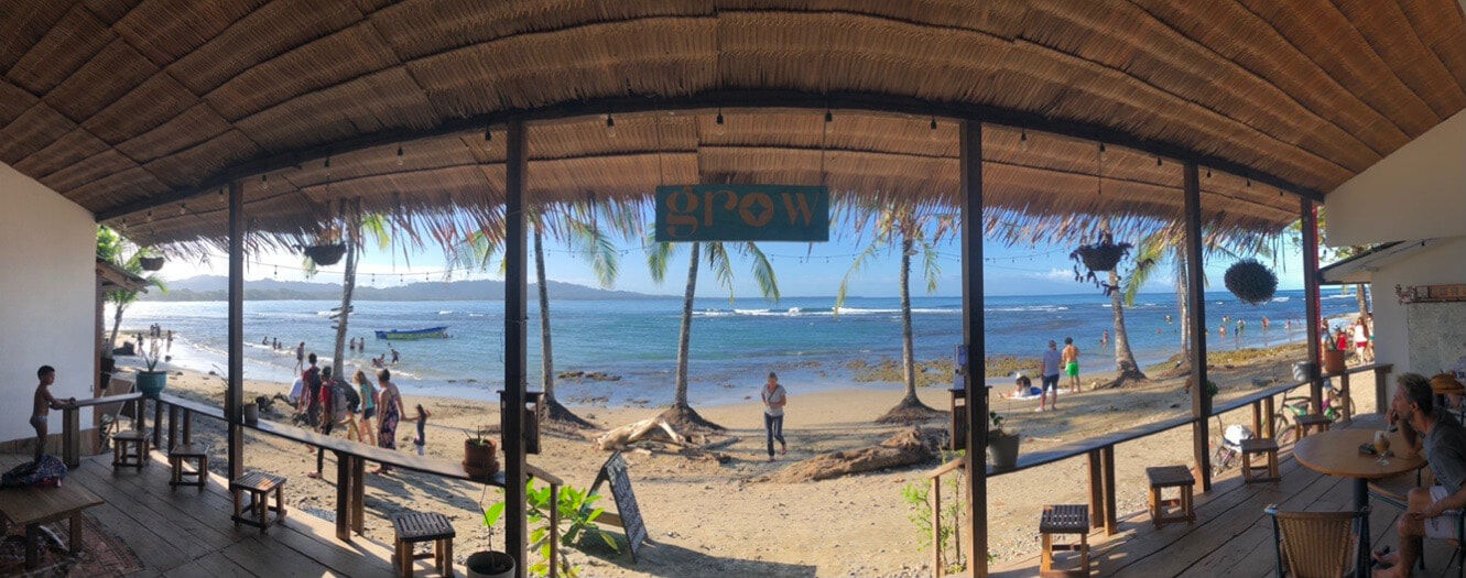 Panorama photo of Playa Chino as seen from inside Grow Cafe in Puerto Viejo, Costa Rica.